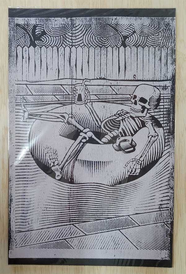 Wood Block Print of Skeleton Relaxing on Raft - Unique Art Piece for Home Decor - Black Paper with White Ink